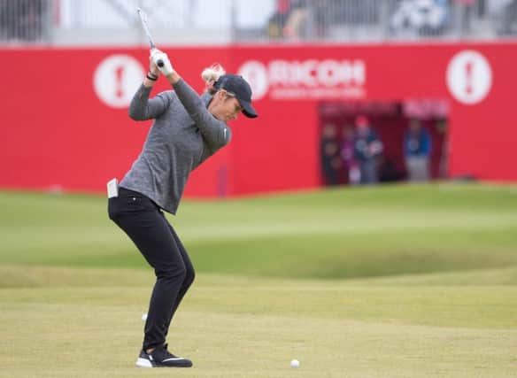 Mel Reid hits her approach to the 18th en route to a five-under 67 in the first round of the Ricoh Women's British Open at Kingsbarns. Picture: Kenny Smith/PA