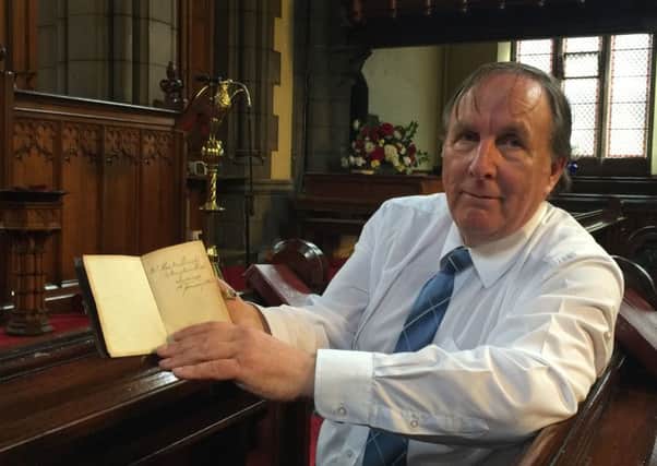 Donald Mackechnie, with a 151-year-old Bible which has been returned to the Scots descendants of its original owner. Picture: The Church of Scotland/PA Wire
