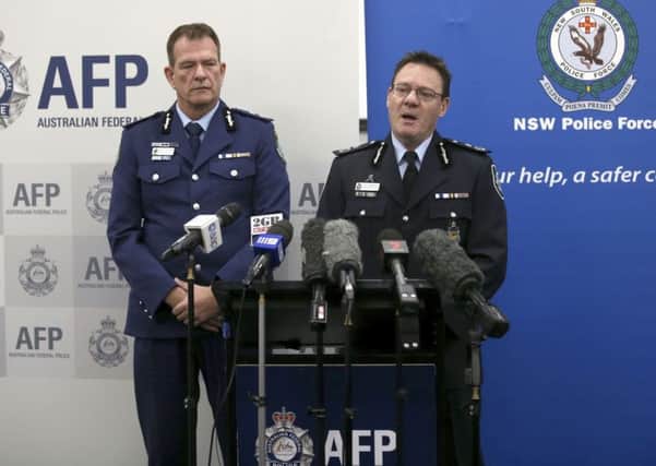Australian Federal Police Deputy Commissioner Michael Phelan, right, and New South Wales state Police Deputy Commissioner David Hudson discuss details of the charging of two men with terrorism offenses in Sydney. Picture; AP