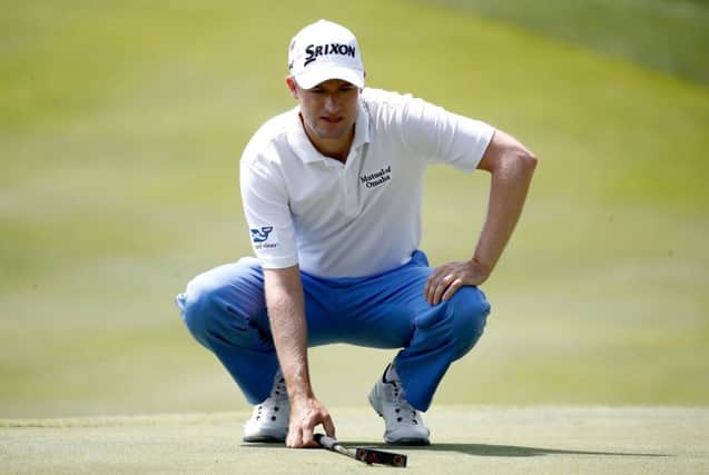 Russell Knox had a good day on the greens in the first round of the WGC-Bridgestone Invitational with his old putter. Picture: Getty Images