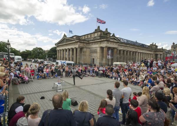 Street performers entertain the crowds at the Mound on the opening day of this years Festival Fringe. Picture: Ian Rutherford