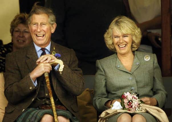 The Prince of Wales with partner Camilla Parker Bowles at the Mey Games.  Photo: David Cheskin/PA