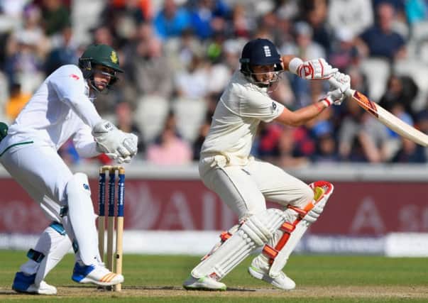 Joe Root cuts a ball to pick up some runs watched by Quinton de Kock. Picture: Getty.