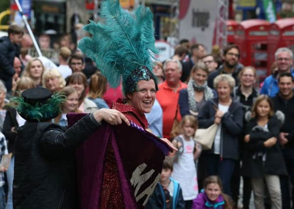 Street performer Able Mable draws the crowds on the Royal Mile Picture: Andrew Milligan/PA Wire