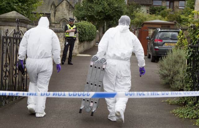 Police forensic teams at the home where Arnold Mouats body was found on Saturday. Picture: SWNS