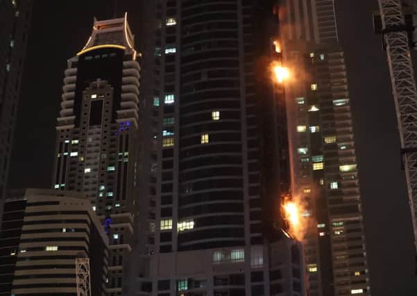 Fire is seen at the 1,105 foot tall Torch tower skyscraper in Dubai. Picture: KARIM SAHIB/AFP/Getty Images