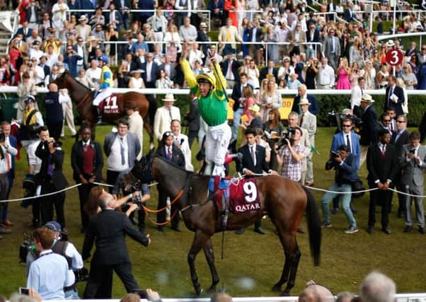 Frankie Dettori leaps from Lancelot Du Lac at Goodwood. Photograph: Paul Harding/PA