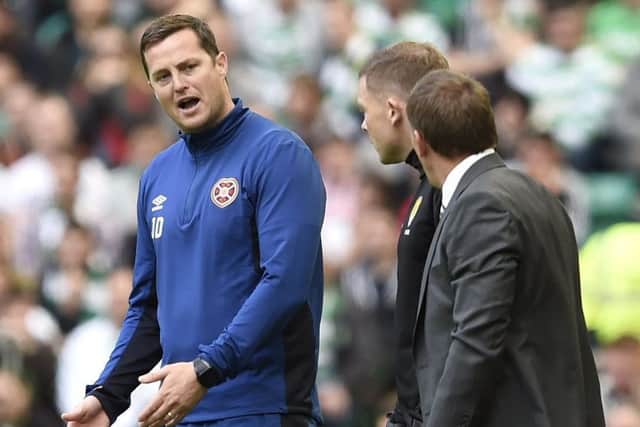 Hearts interim manager Jon Daly has words with Celtic manager Brendan Rodgers. Picture: Ian Rutherford/PA Wire