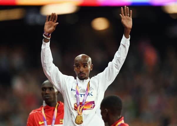 Mo Farah celebrates winning gold in the Men's 10000 metres. Picture: Shaun Botterill/Getty Images