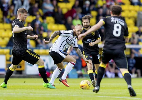 Dunfermline's Kallum Higginbotham in action against Alan Lithgow (left). Picture: SNS/Alan Rennie