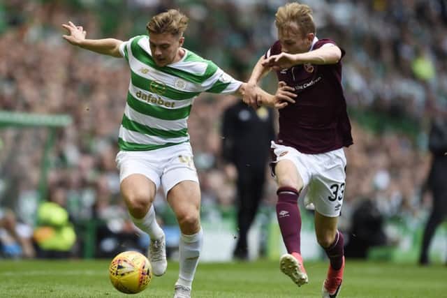 Celtic's James Forrest and Hearts' Lewis Moore tussle. Picture: Ian Rutherford/PA Wire