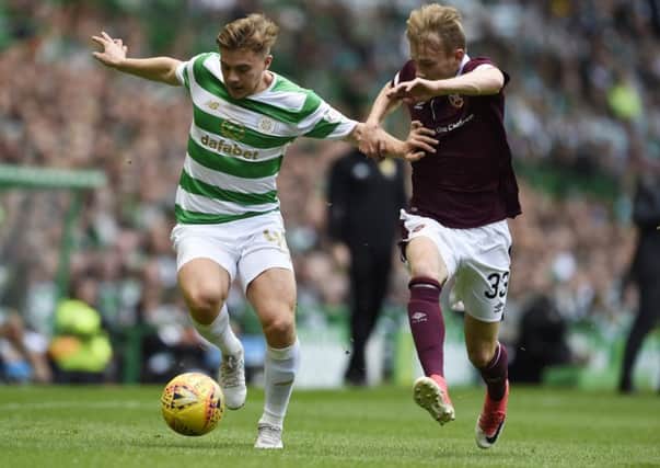 Celtic's James Forrest and Hearts' Lewis Moore tussle. Picture: Ian Rutherford/PA Wire