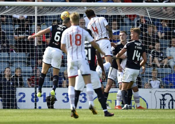 Ross County's Christopher Routis scores to make it 2-0. Picture: SNS/Rob Casey