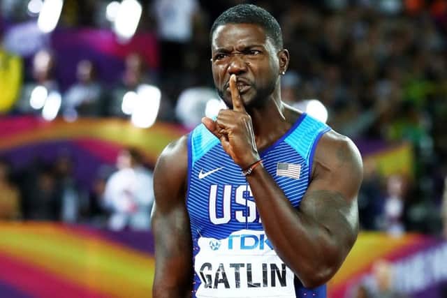Justin Gatlin raises a finger to his lips to silence the crowd's boos after he beat Usain Bolt into third place in the Men's 100 metres final.  Picture: Michael Steele/Getty Images
