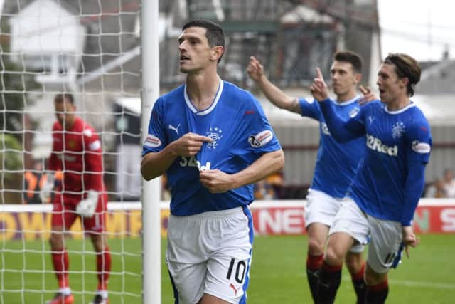 Graham Dorrans celebrates after firing Rangers ahead from the penalty spot against Motherwell. Picture: Rob Casey/SNS