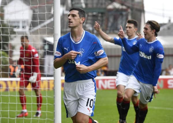 Graham Dorrans celebrates after firing Rangers ahead from the penalty spot against Motherwell. Picture: Rob Casey/SNS