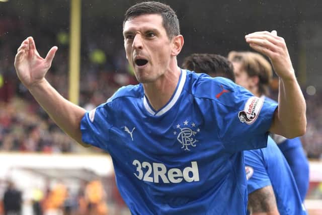 Graham Dorrans celebrates after firing Rangers ahead from the spot. Picture: SNS