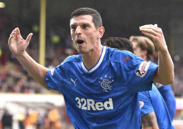 Graham Dorrans celebrates after firing Rangers ahead from the spot. Picture: SNS