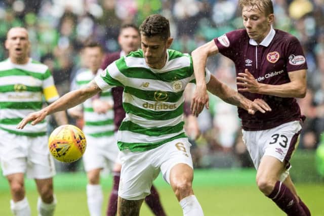 Celtic's Nir Bitton is put under pressure by young Hearts winger Lewis Moore. Picture: Alan Harvey/SNS