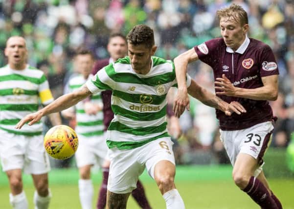 Celtic's Nir Bitton is put under pressure by young Hearts winger Lewis Moore. Picture: Alan Harvey/SNS
