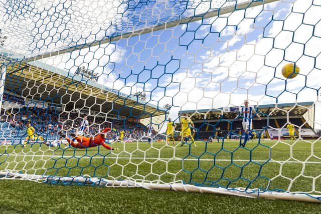 St Johnstone's Michael O'Halloran (left) scores his side's winning goal against Kilmarnock at Rugby Park. Picture: SNS