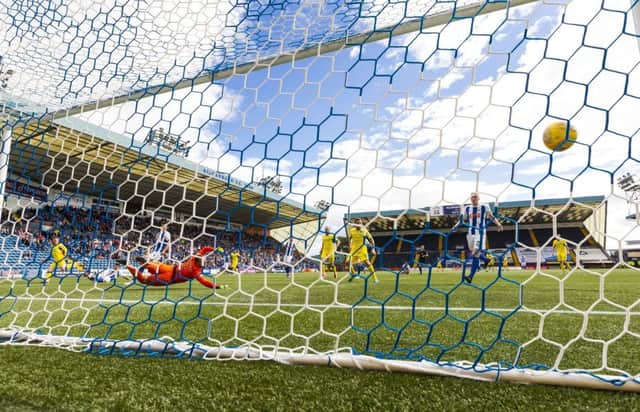 St Johnstone's Michael O'Halloran (left) scores his side's winning goal against Kilmarnock at Rugby Park. Picture: SNS