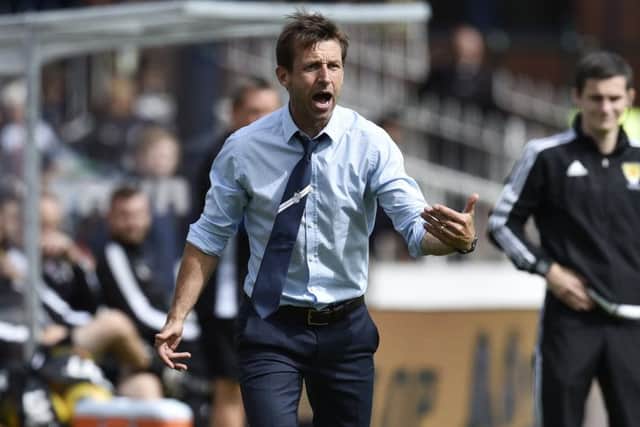 Dundee manager Neil McCann urges on his side against Ross County. Picture: Rob Casey/SNS