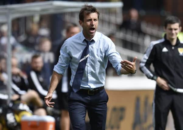 Dundee manager Neil McCann urges on his side against Ross County. Picture: Rob Casey/SNS