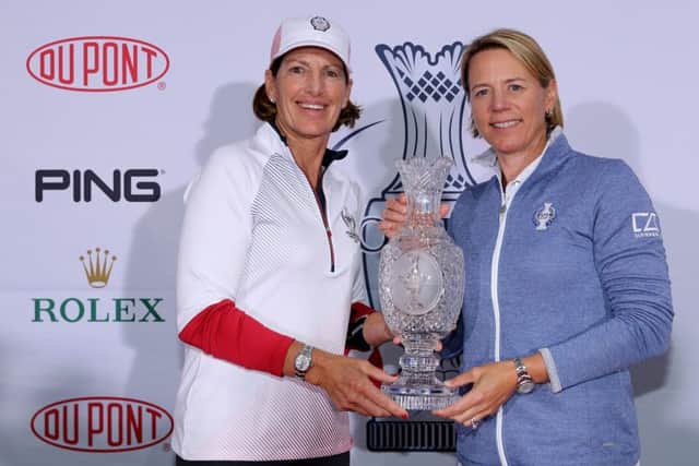 Juli Inkster and Annika Sorenstam pose with the Solheim Cup trophy before naming their teams. Picture: Getty.