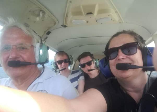 Karen Cox flying with her family. Picture: Supplied