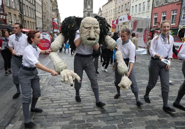 Edinburgh Fringe performers perform a scene from their production of Peer Gynt on the Royal Mile. Picture: Andrew Milligan/PA Wire