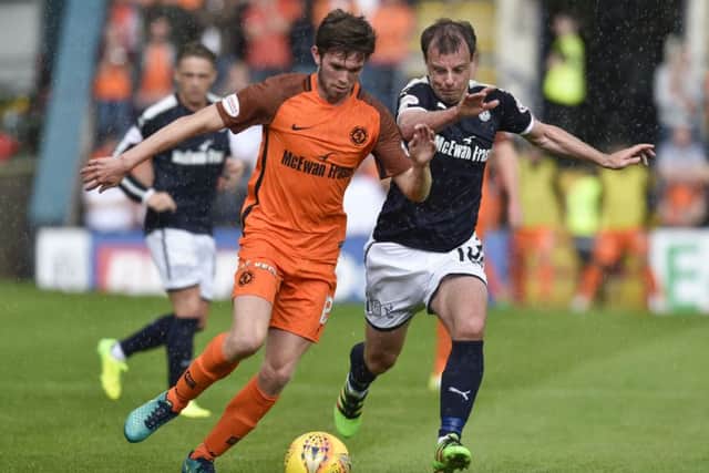 Dundee's Paul McGowan challenges Dundee United's Sam Stanton during the Betfred Cup group stage match last month. Picture: Rob Casey/SNS