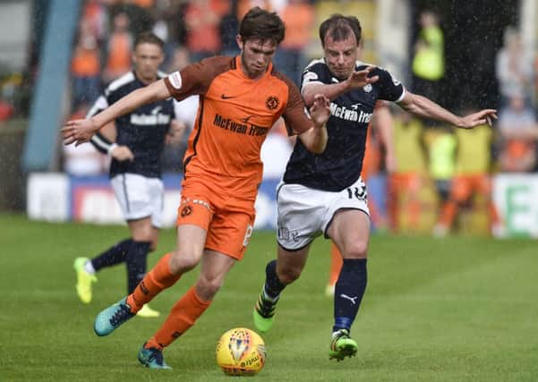 Dundee's Paul McGowan challenges Dundee United's Sam Stanton during the Betfred Cup group stage match last month. Picture: Rob Casey/SNS