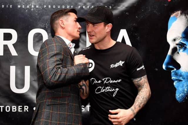 Anthony Crolla, left, and Ricky Burns shake hands during a press conference in Manchester. Picture: Anthony Devlin/PA Wire