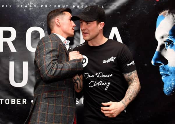 Anthony Crolla, left, and Ricky Burns shake hands during a press conference in Manchester. Picture: Anthony Devlin/PA Wire