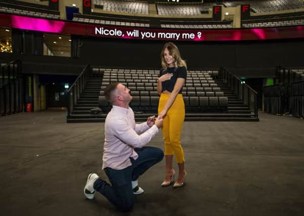 The proposal of Jamie McGuire (24) to Nicole Short (23).
 Picture: John Devlin