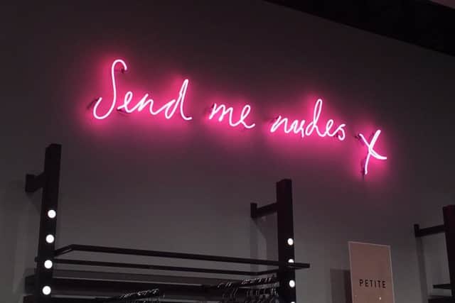 Campaigners have demanded a neon sign reading "Send me nudes" in the Missguided Bluewater store be removed. Picture: Rebecca Rumsey/PA Wire