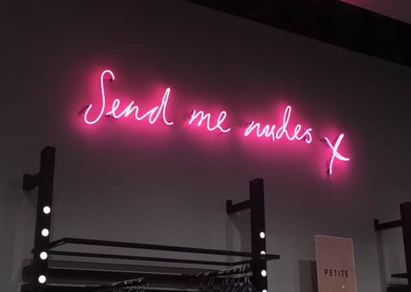 Campaigners have demanded a neon sign reading "Send me nudes" in the Missguided Bluewater store be removed. Picture: Rebecca Rumsey/PA Wire