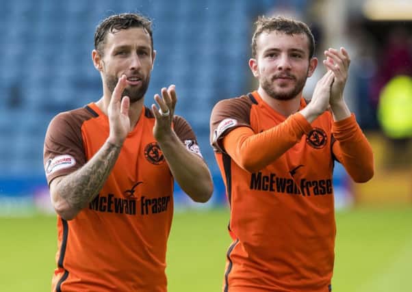 Scott McDonald, left, with Paul McMullan after Dundee United's win on penalties against Dundee in the Betfred Cup group match. Picture: Craig Williamson/SNS