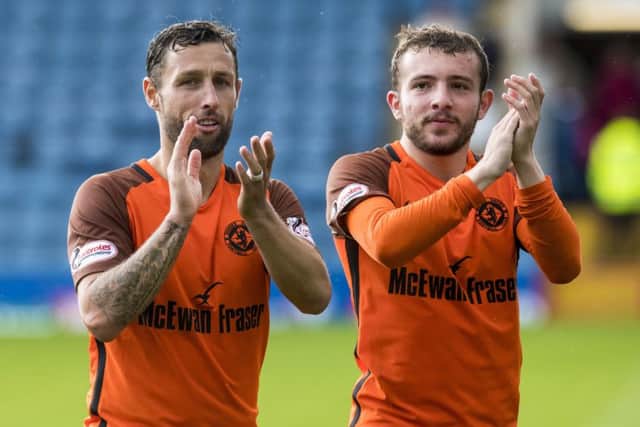 Scott McDonald, left, with Paul McMullan after Dundee United's win on penalties against Dundee in the Betfred Cup group match. Picture: Craig Williamson/SNS