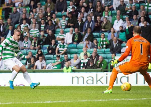 Celtic's Leigh Griffiths fires the third goal past Kilmarnock goalkeeper Jamie MacDonald. Picture: SNS/Alan Harvey