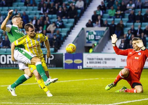 Anthony Stokes pounces to make it 3-0 to Hibs. Picture: Roddy Scott/SNS