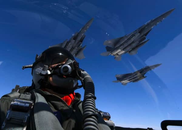 A US pilot joins up with Republic of Korea air force F-15s during a mission from Andersen Air Force Base, Guam. Picture: AFP/Getty Images