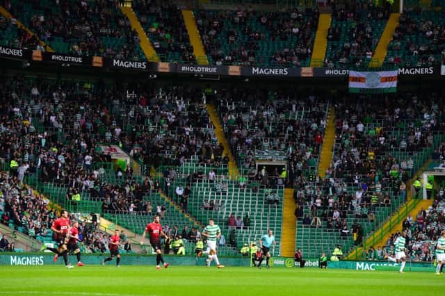 The area usually occupied buy the Green Brigade is sparsely filled at Celtic Park. Picture: SNS