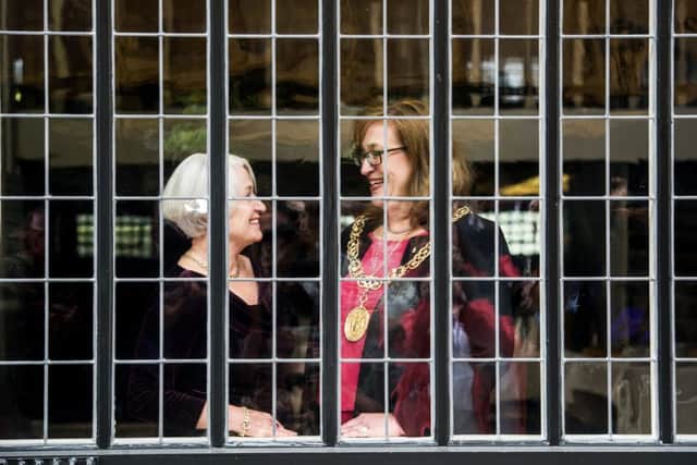 Celia Sinclair, chair of The Willow Tea Rooms Trust,  and Lord Provost Eva Bolander behind the refurbished ground floor window. Picture: John Devlin/TSPL