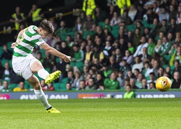 Celtic's Kieran Tierney fires in his goal from 40 yards. Picture: SNS