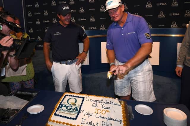 Phil Mickelson and Ernie Els celebrate their 100th major prior to the US PGA Championship at Quail Hollow. Picture: Ross Kinnaird/Getty Images