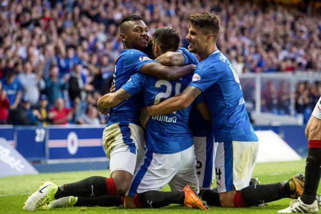 Rangers' Daniel Candeias (centre) celebrates his goal with Alfredo Morelos (left) and Fabio Cardoso at full-time. Picture: Paul Devlin/SNS