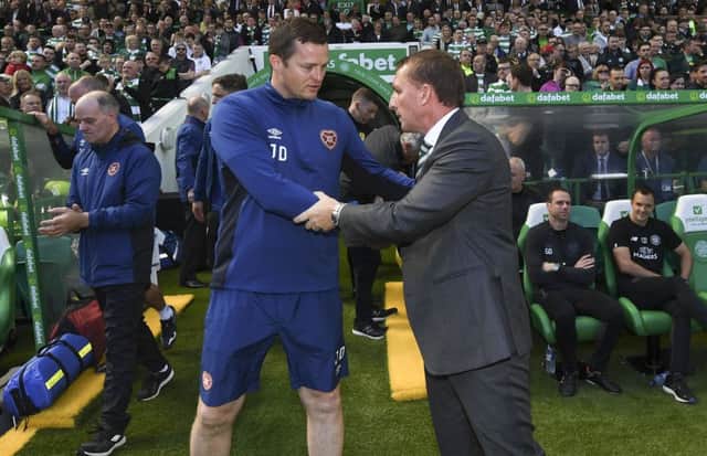 Jon Daly and Brendan Rodgers prior to Celtic's 4-1 defeat of Hearts. Picture: SNS