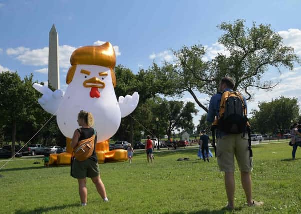 An inflatable version of Donald Trump as a chicken appeared outside the White House. Picture: AFP/Getty Images
